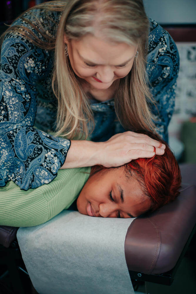 Dr. Cynthia Seebacher, DC adjusting a female patient