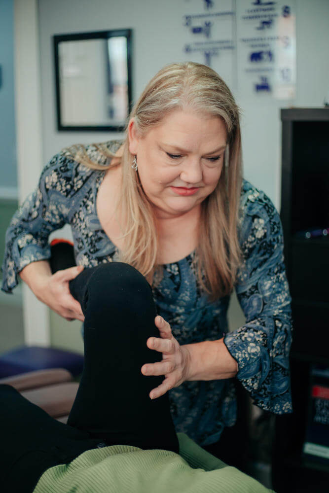 Dr. Cynthia Seebacher, DC adjusting a patient