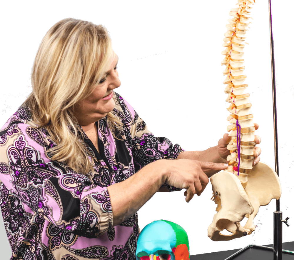 Dr. Cynthia Seebacher, DC demonstrating where the lumbar discs are on the spine.