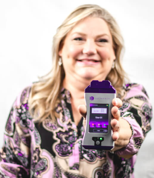 Dr. Cynthia holding an Erchonia EVRL cold laser.